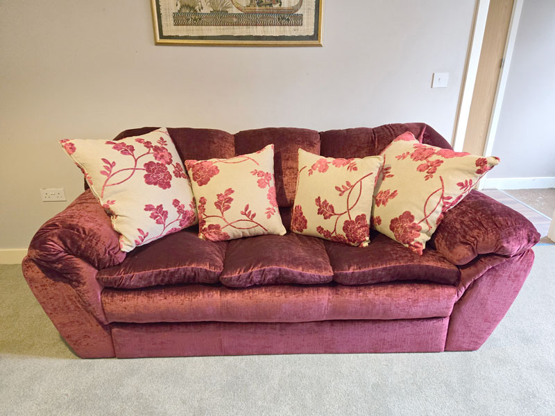 New Ercol dining chair cushions showing the webbing and stud fastenings