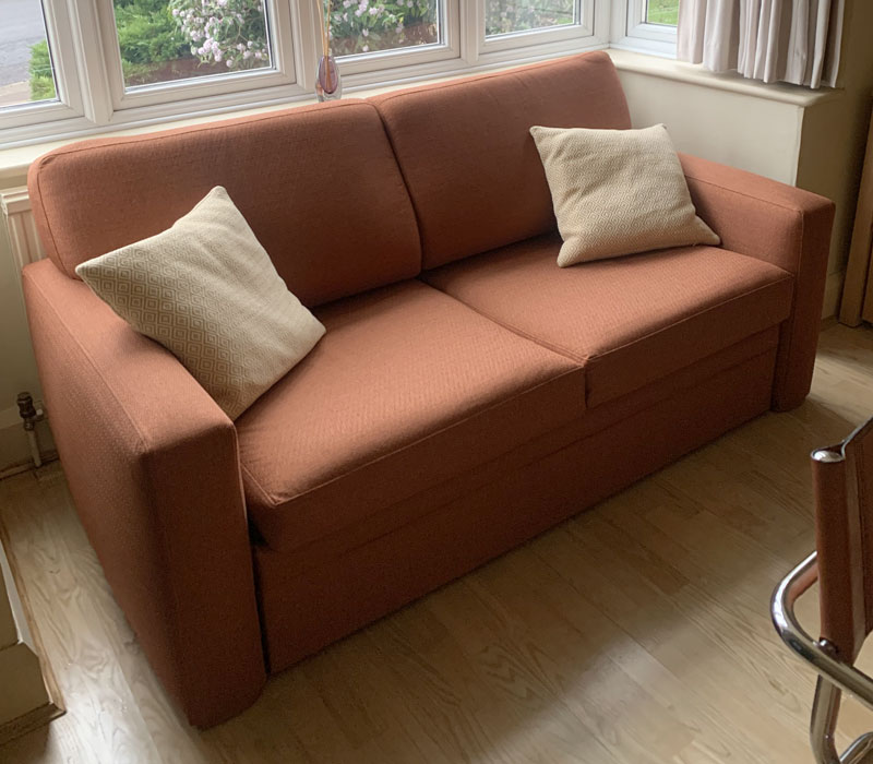 New Ercol dining chair cushions showing the webbing and stud fastenings