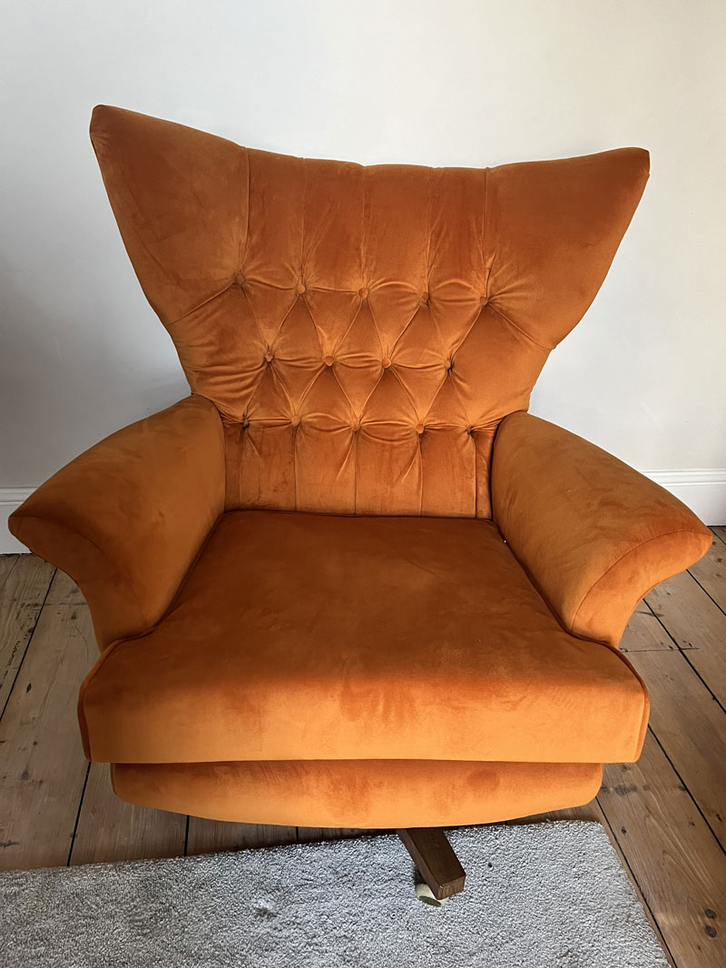 New Ercol dining chair cushions showing the webbing and stud fastenings